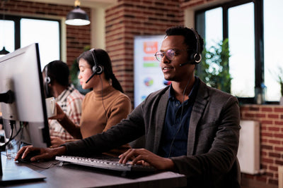 african-american-helpline-employee-working-call-center-reception-with-multiple-monitors-male-operator-using-telecommunication-help-clients-customer-service-support-remote-network - Big House Home