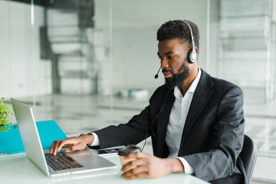 african-american-man-customer-support-operator-with-hands-free-headset-working-office_1 - Big House Home